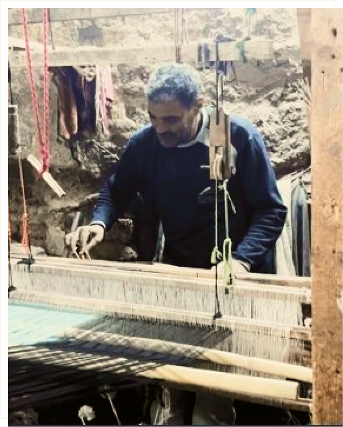 Master weaver at the loom in Naqada
